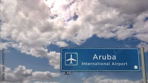 Aruba Caribbean Jet plane landing. City arrival with airport direction sign. Travel, business, tourism and airplane transport concept.