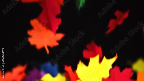 Colorful Paper Leaves Falling Against Black Background Abstract Motion.