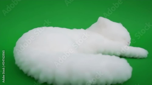 Fluffy White Cat Resting on Green Background, Peaceful Relaxation.