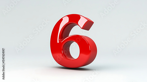 A shiny red number six standing upright on a white surface with a soft shadow behind it in studio lighting