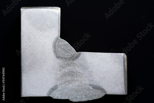 T-joint weld macroetch sample. Etched cross-section shows fillet weld structure, fusion zones, HAZ, weld passes. Used in NDT training, welding QA/QC, metallurgy, and defect evaluation.