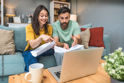Successful young business people working together in home office. Freelance couple teamwork businessman and businesswoman startup concept video call presentation on laptop computer and webcam