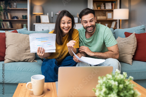 Successful young business people working together in home office. Freelance couple teamwork businessman and businesswoman startup concept video call presentation on laptop computer and webcam