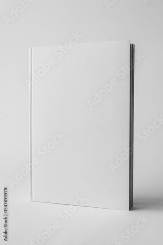 Blank white book cover isolated on gray background