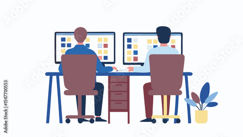 Two people working at desks with computers displaying grids in an office environment setting shown