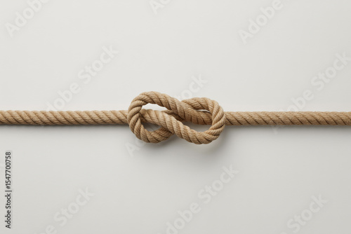 Rope knot isolated on white background symbolizes nautical connection