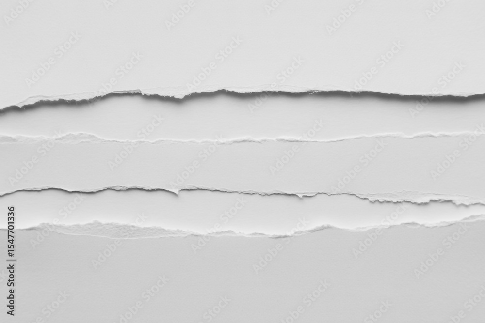 Obraz premium Torn white paper edges on a white background