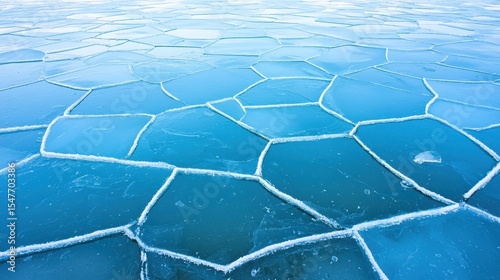 Cracked ice surface textured blue glacial ice pattern frozen winter cold