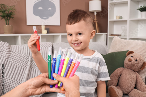 Cute little boy taking felt...