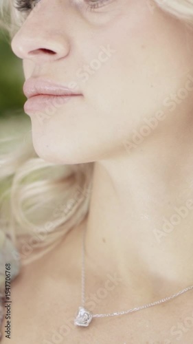 Woman Enjoying the Scent of a Flower