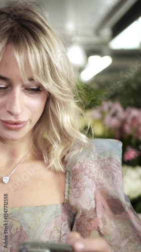 Woman Enjoying the Scent of a Flower