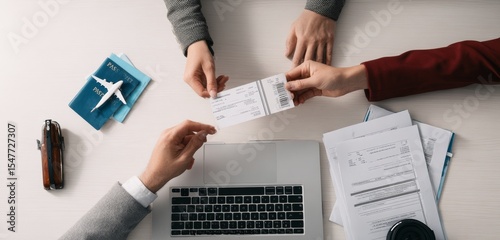 Booking Flight Tickets Travel planning, passport, laptop and document on the table for summer trip
