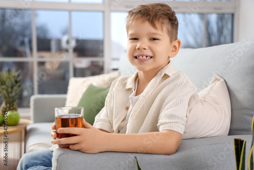 Cute little boy with glass ...