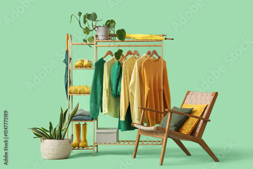 Rack with clothes, armchair...