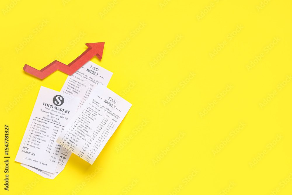 Naklejka premium Receipts from food market with red arrow on yellow background. Price rise concept