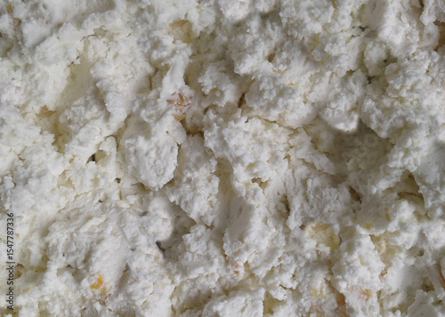 Cottage cheese background. Milk curd top view. Closeup