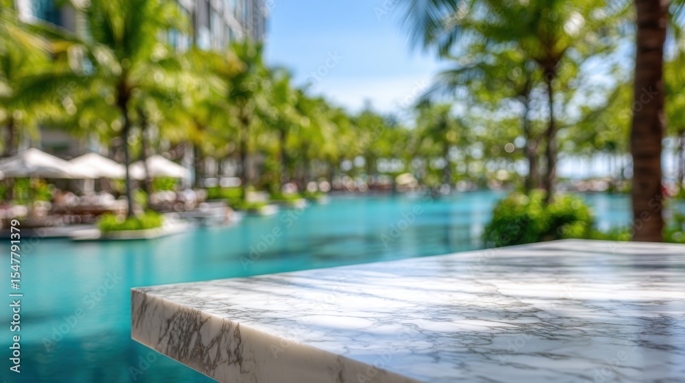 Fototapeta premium Marble tabletop overlooking tropical pool and palm trees