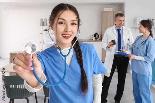 Female Asian medical intern...