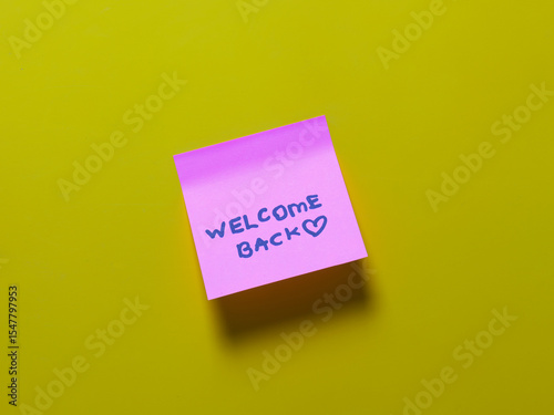 Welcome back note on bright yellow background