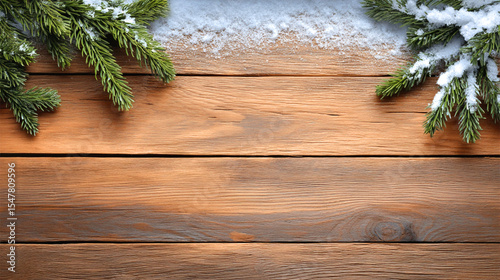 Winter seasonal backdrop featuring snow-dusted evergreen branches on rustic wooden surface