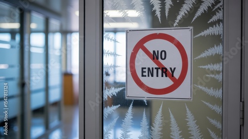 Frozen office door with No Entry sign covered in frost, symbolizing hiring freeze and corporate restrictions, workplace access denied concept.