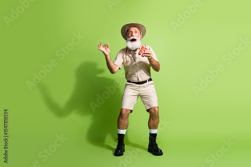 photo of amazed scientist biologist hold product binoculars feel impressed isolated green color background