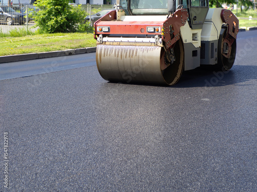 Asphalt paving vehicle. Rol...