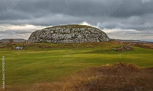 Cloudy Hilltop with a Rounded Stone Formation
