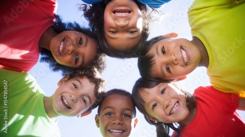 Diverse children forming a huddle, radiating joy and unity in the sun