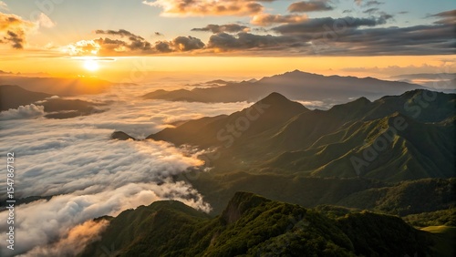 Sunrise over majestic mountain range and clouds