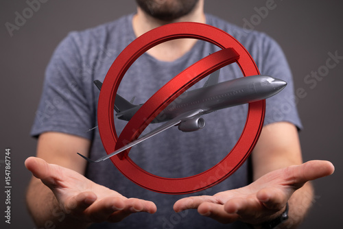 Stock photo of a no fly zone symbol with an airplane. Perfect for travel restrictions, flight cancellations, and airport closures.