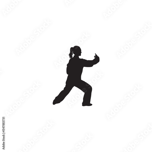 Silhouette of woman practicing tai chi martial arts slow motion exercise