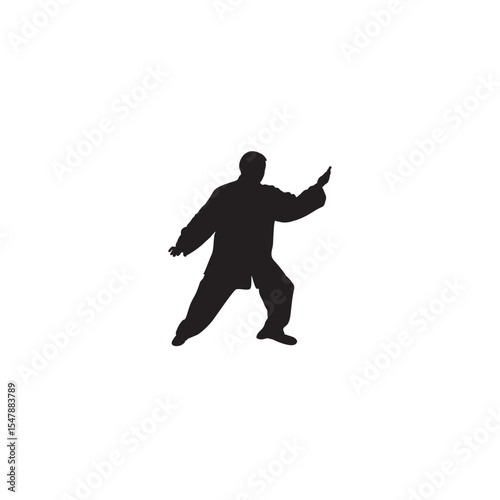 Silhouette of tai chi practitioner demonstrating a pose in traditional clothing