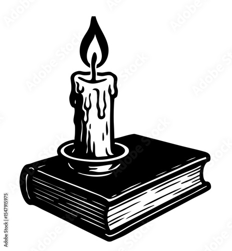A burning candle and an old book