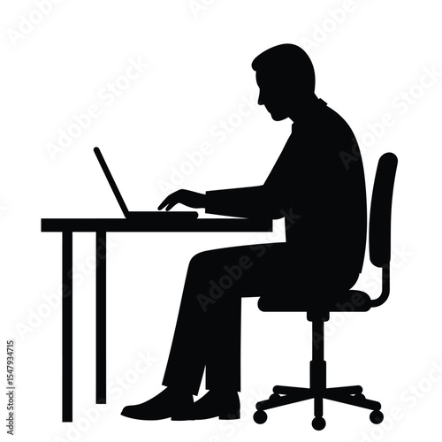 silhouette of a man working on a laptop
