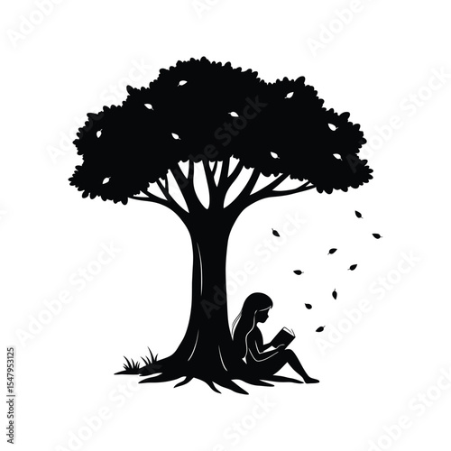Girl reading book under autumn tree silhouette