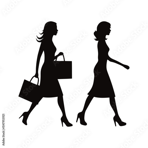 Silhouette of two women walking with shopping bags