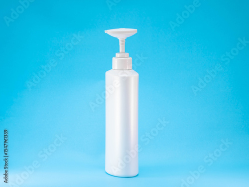 White Plastic Pump Bottle on Blue Background