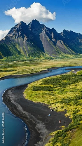 Serene Mountain River Landscape with Lush Green Valleys and Majestic Peaks