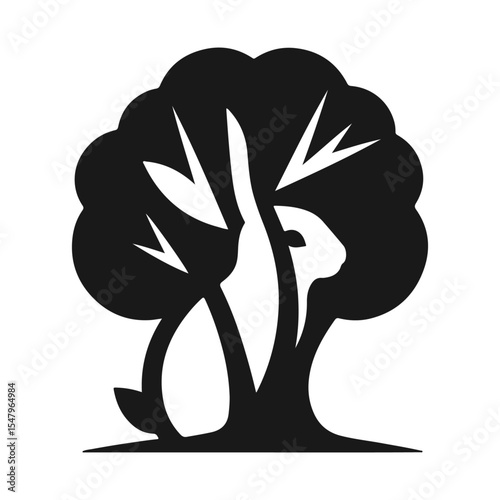 Design a minimalist black-and-white logo using negative space to reveal a rabbit within or around a tree shape
