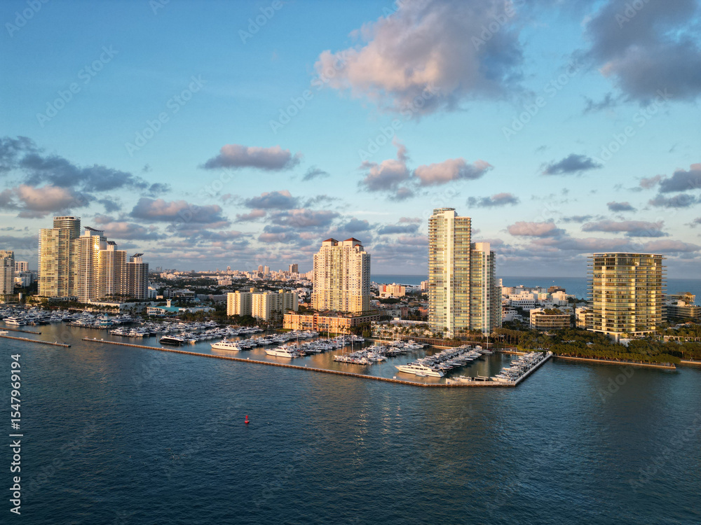 Fototapeta premium Aerial view of luxury yachts in Miami marina. Scenic panorama of boats and skyscrapers in Miami marina.