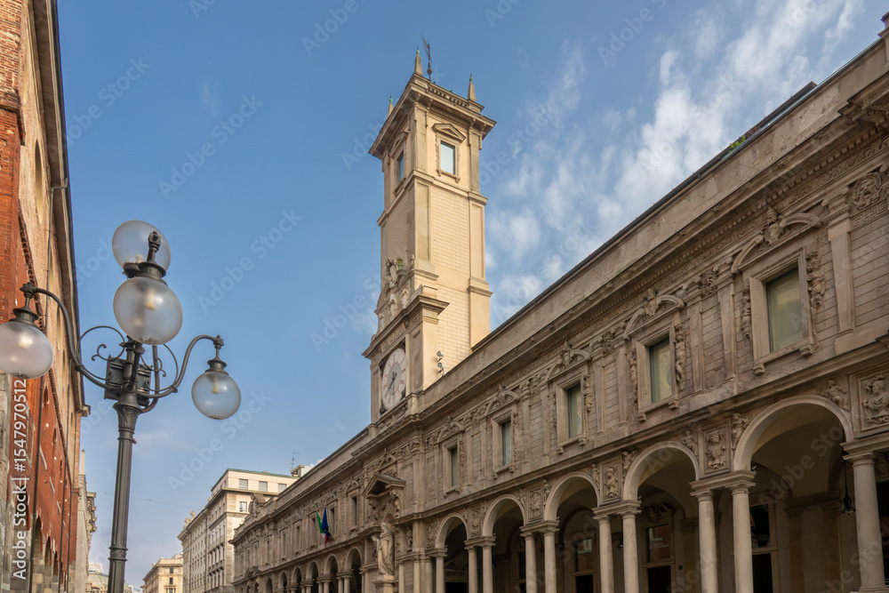 Fototapeta premium Ancient clock tower of the Giureconsulti Palace also known as Palazzo Affari. The Palazzo dei Giureconsulti or Palazzo Affari ai Giureconsulti, is a 16th-century building of Milan, Italy