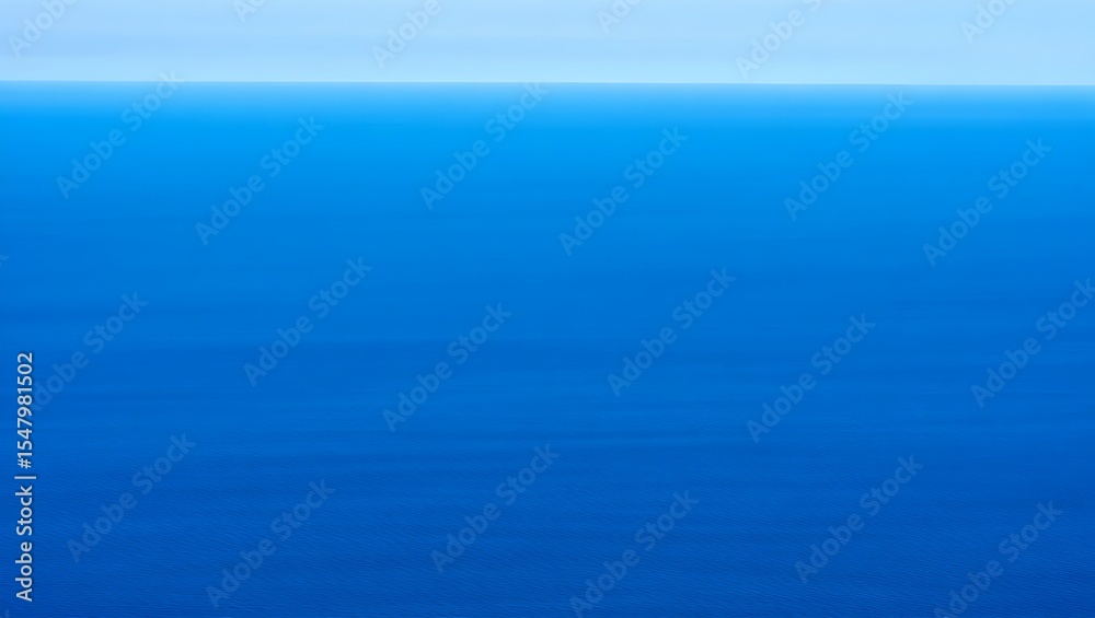 Obraz premium A serene view of the ocean with a clear horizon line and gradient of blue hues in the sky and water