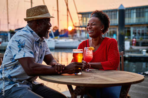 Elderly couple enjoying a drink at seaside restaurant during vacation