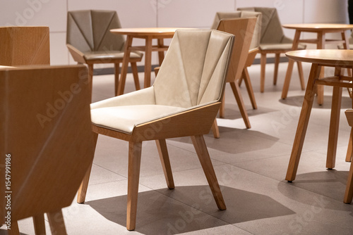 Modern chairs in empty cafe with natural light photo