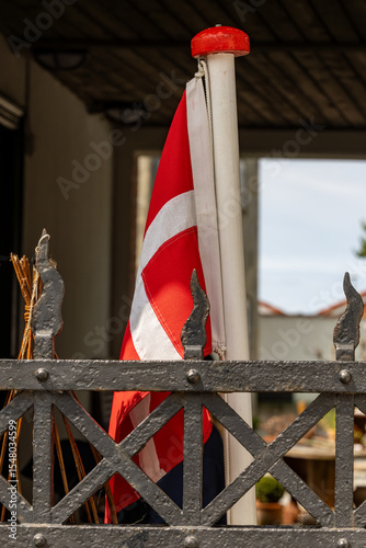 Ringkobing, Denmark A Danish flag hangs outside an antique shop.