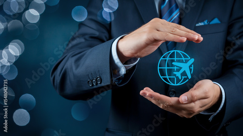 A professional business photo of hands in a dark navy suit holding a glowing blue digital globe icon with a flying airplane symbol.