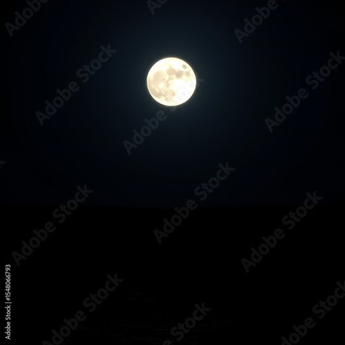 A luminous full moon illuminates the dark ocean waters tonight