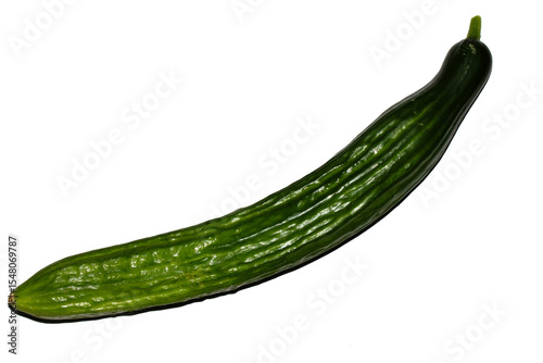 Close up of home grown cucumber vegetable skin green on white background