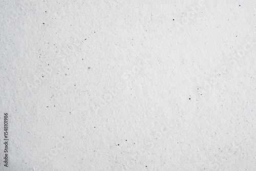 White sand background. Beautiful creative natural background with visible little sand texture. Sand on the ground. Rough texture, construction material background